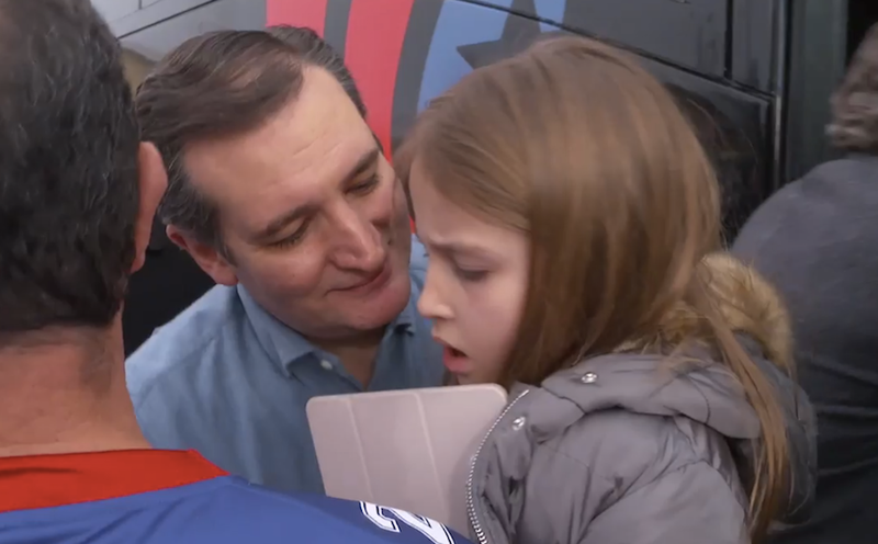 Caroline Cruz’s father tries to kiss her goodbye as she gets back on the campaign bus in Iowa. This is repulsive and embarrassing for Caroline, who would love nothing more than to wipe that weird smile off his face. “Ow, ow, ow!” she screams, knowing that this will humiliate him. A strange feeling follows—satisfaction, she realizes. (Screenshot/Twitter)